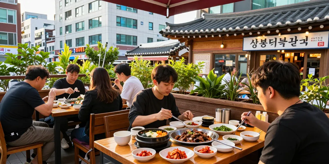 Friends enjoying traditional Korean dishes at 상봉동 한국관, a lively restaurant in Sang-bong-dong.